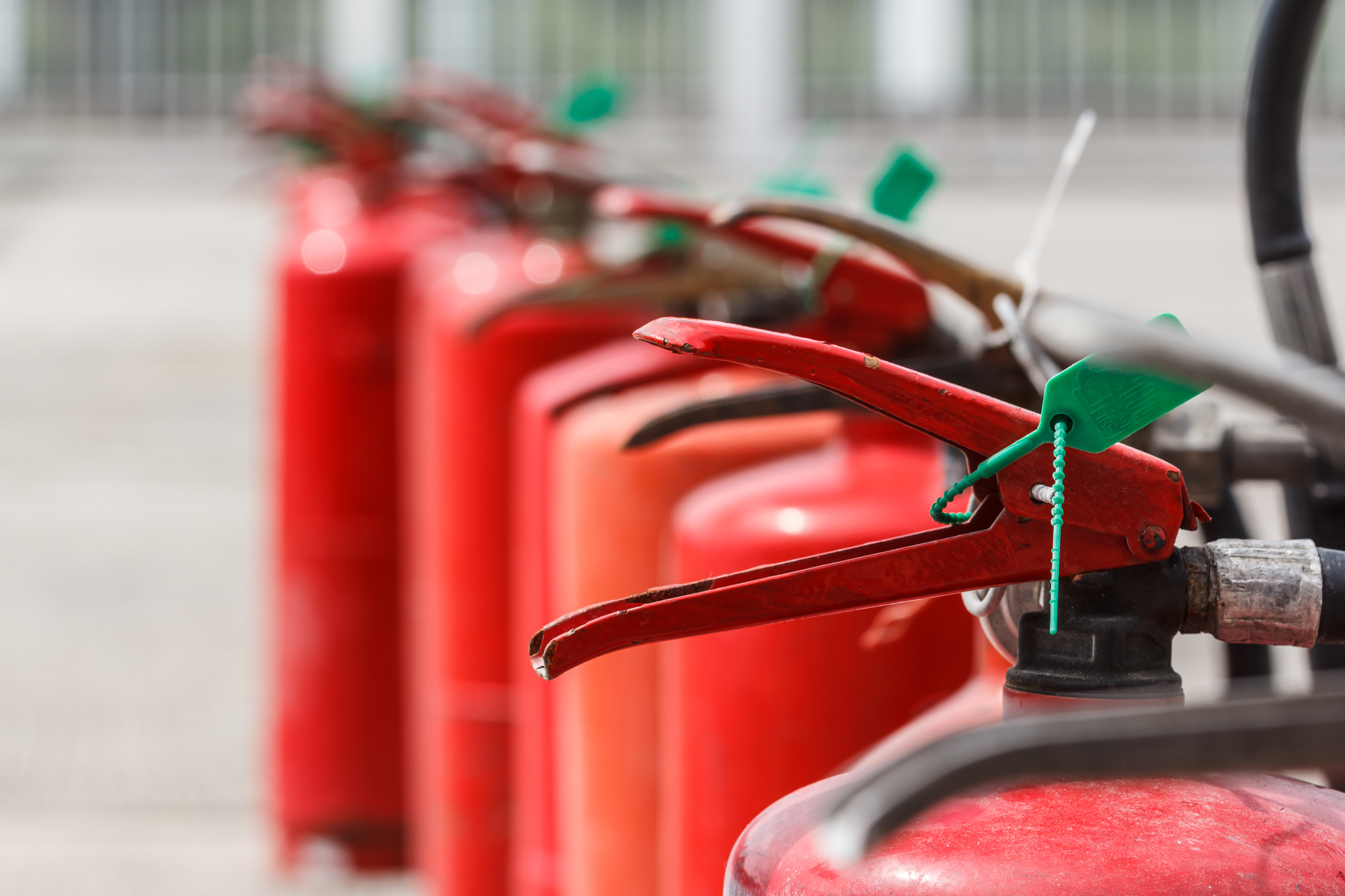 Fire extinguisher red tank in outdoor