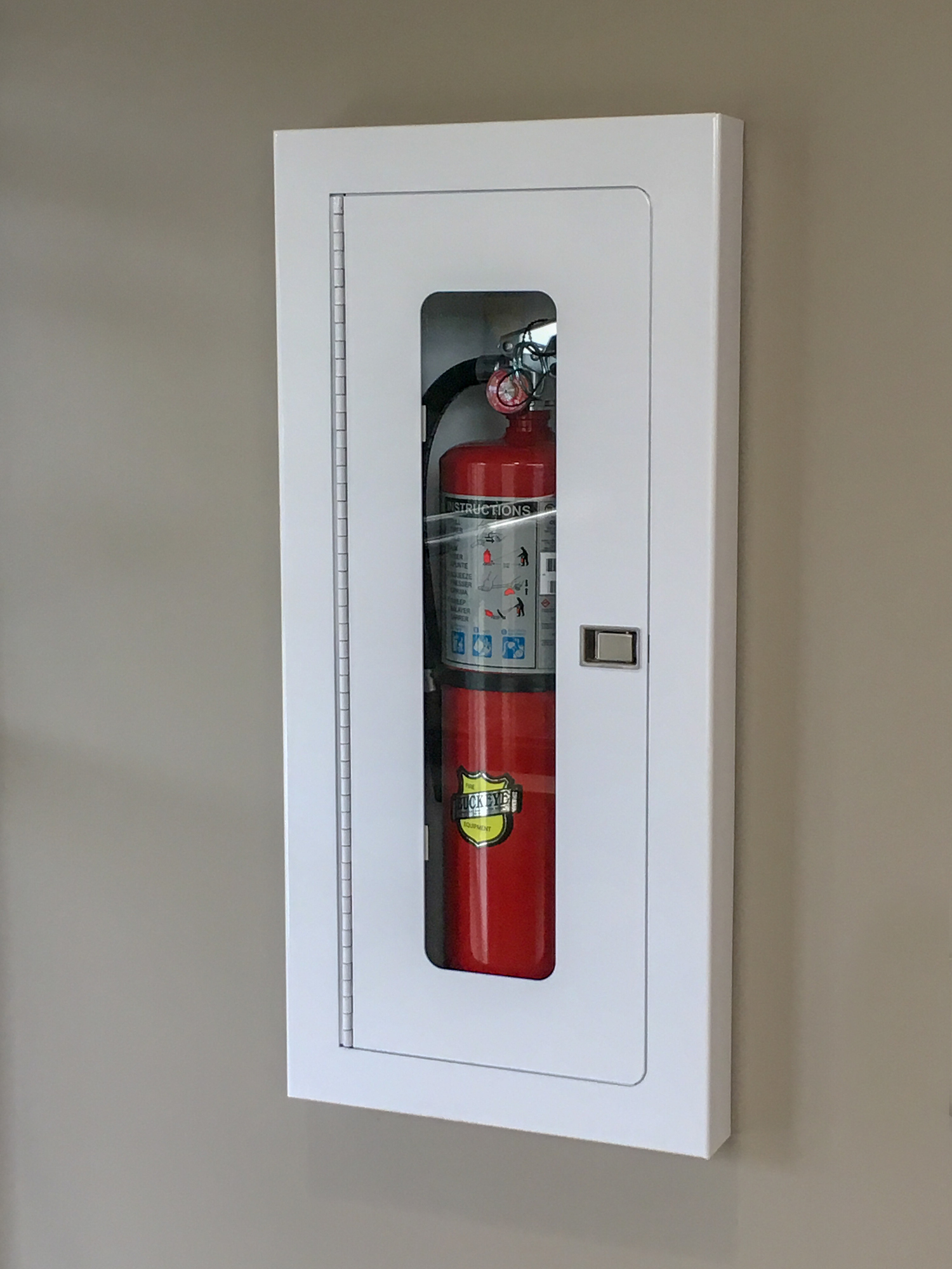 Where should fire extinguishers be located in an office?